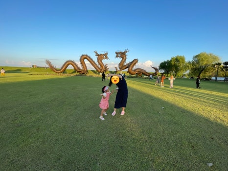In front of a dragon statue in Korea